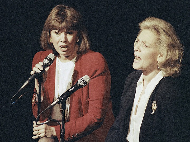  In this Dec. 13, 1990, file photo, Phyllis Newman, left, and Lauren Bacall sing during a tribute to the late conductor Leonard Bernstein, at New York's Majestic Theatre. Newman, a Tony Award-winning Broadway veteran who became the first woman to host "The Tonight Show" before turning her attention to fight for women's health, died Sunday, Sept. 15, 2019, in New York. She was 86. (AP Photo/Mark Lennihan, File)