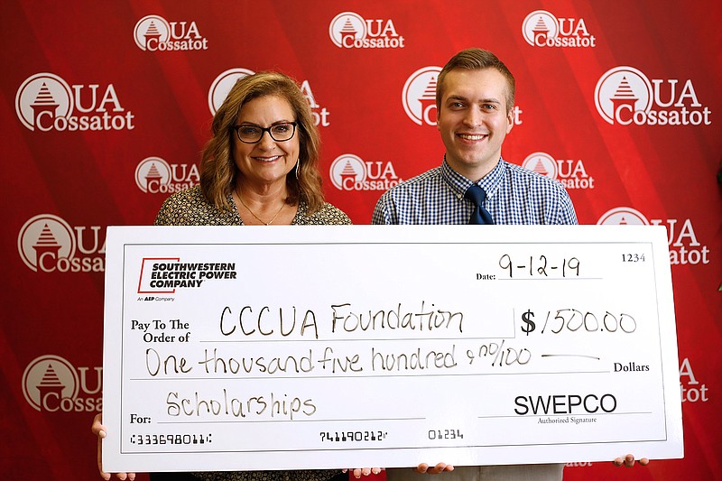 AEP Southwestern Electric Power Co. recently donated $1,500 to the University of Arkansas Cossatot Foundation for scholarships. Shown are, from left, AEP SWEPCO External Manager Jennifer Harland and UA Cossatot Foundation Director Dustin Roberts.
