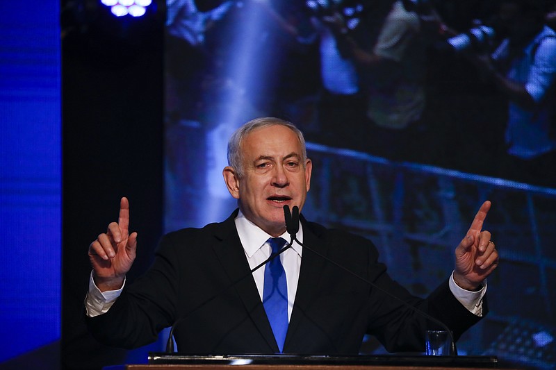 Israeli Prime Minister Benjamin Netanyahu addressees his supporters at party headquarters after elections in Tel Aviv, Israel, Wednesday, Sept. 18, 2019. (AP Photo/Ariel Schalit)