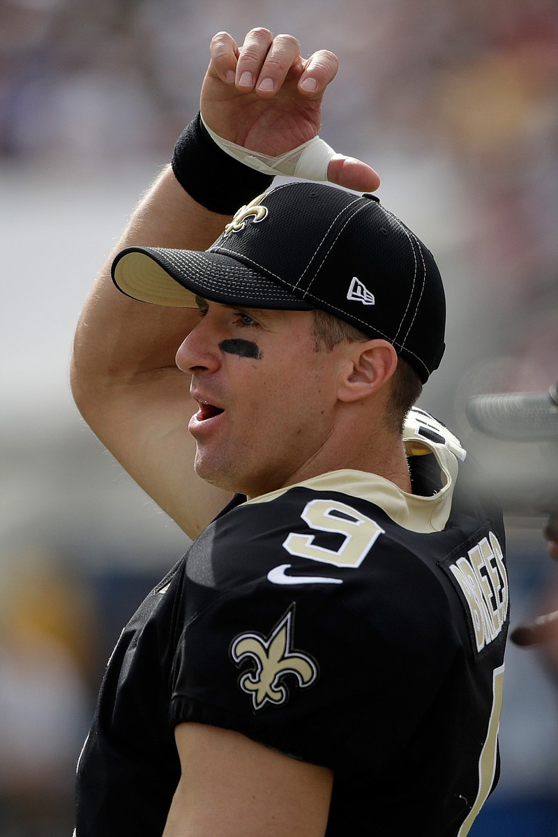 New Orleans Saints quarterback Drew Brees watches from the sidelines after getting during the first half of an NFL football game against the Los Angeles Rams Sunday, Sept. 15, 2019, in Los Angeles (AP Photo/Marcio Jose Sanchez)