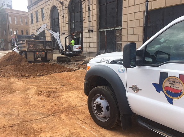 Chunks of sidewalk were being scooped up Thursday night in front of the Grim Hotel on State Line Avenue downtown. The debris was a result of efforts to put in a new sewer line by Texarkana Water Utilities.
