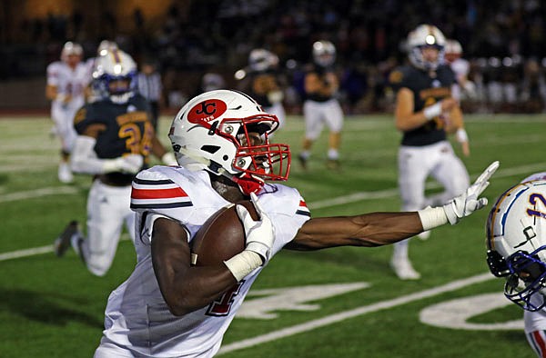 Jefferson City running back David Bethune stiff arms Hickman's LJ Williams during last Friday night's game in Columbia. 