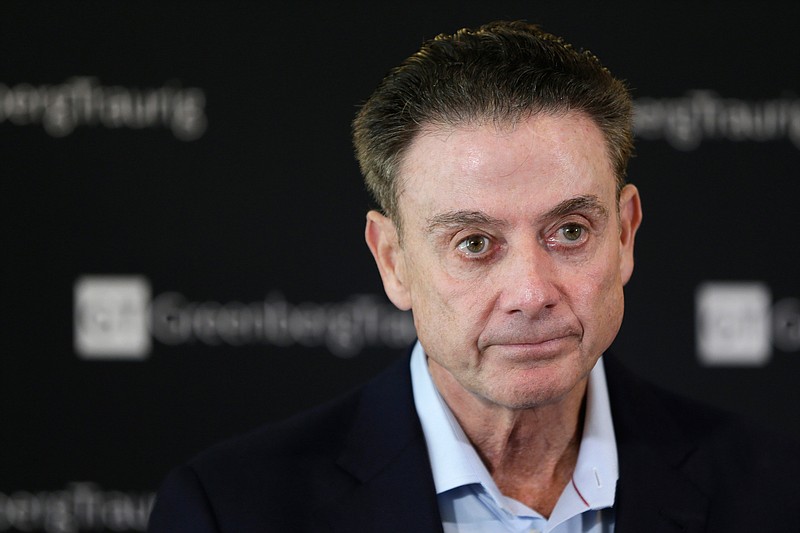 FILE - In this Feb. 21, 2018, file photo, former Louisville basketball coach Rick Pitino talks to reporters during a news conference in New York. The University of Louisville Athletic Association and Rick Pitino have agreed to settle a federal lawsuit, with the former Cardinals men's basketball coach's changing his termination to a resignation. The settlement unanimously approved Wednesday, Sept. 18, 2019, by the ULAA states that Pitino has received compensation and the school agrees not to pursue further legal action. (AP Photo/Seth Wenig, File)