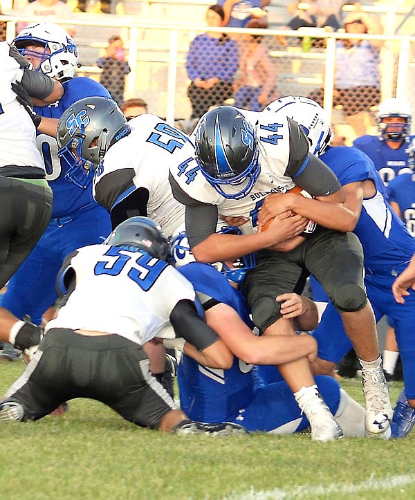 South Callaway sophomore running back Jasper Rees battles for yardage during the Bulldogs' 53-21 loss to Montgomery County in last Friday's Eastern Missouri Conference opener in Montgomery City.