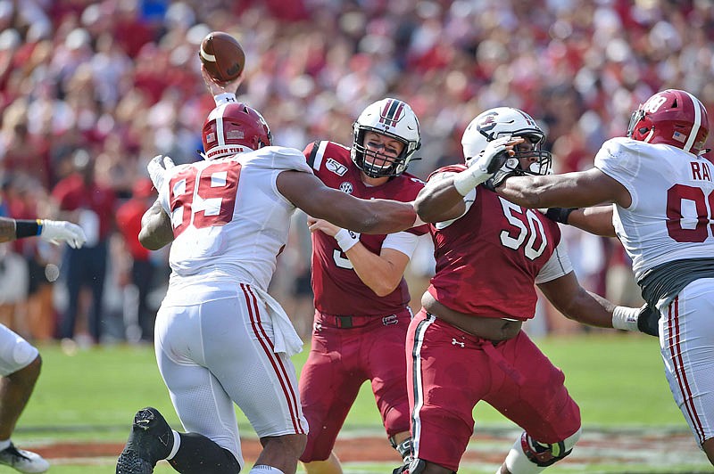 South Carolina quarterback Ryan Hilinski throws while under pressure by Alabama's Raekwon Davis during last Saturday's game in Columbia, S.C.