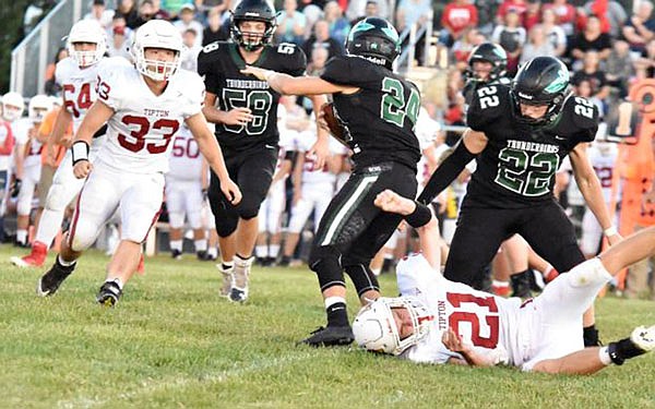 Tipton quarterback Dylan Kuttenkuler is knocked to the turf during a game against North Callaway earlier this month in Kingdom City.