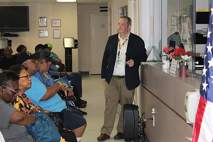 Mark Woodall, public affairs specialist with the VA Overton Brooks facility in Shreveport, La., shares updates with area veterans at a town hall meeting Thursday evening, September 19, 2019, at the Texarkana Area Veterans Administration Outpatient Clinic. Staff photo by Junius Stone