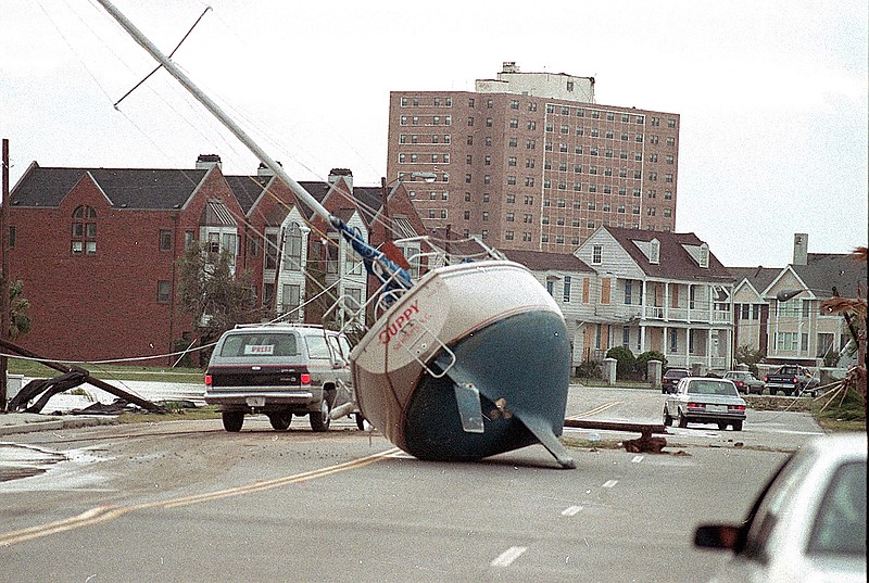 A sailboat lies in the street Sept. 22, 1989, in Charleston, S.C., after it was washed ashore by Hurricane Hugo. From evacuating hundreds of thousands of people from the coast to live TV coverage in the shrieking wind and rain, 1989's Hurricane Hugo might have been the first U.S. storm of the modern age.