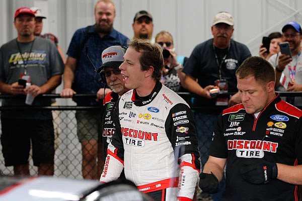 Brad Keselowsk celebrates in the garage Friday after winning the pole for tonight's NASCAR Cup Series race at Richmond Raceway in Richmond, Va.