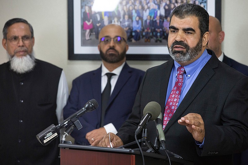 n this Thursday, Sept. 19, 2019 photo, Abderraoof Alkhawaldeh, right, speaks during a news conference at the Council on American-Islamic Relations DFW office in Dallas. Alkhawaldeh and Issam Abdallah, second from left, who are both Muslim, said they were profiled and discriminated against during a recent American Airlines flight in Alabama, and CAIR is calling on the airline to investigate the incident and implement corrective action to those involved.