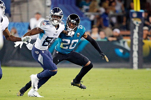 Jaguars cornerback Jalen Ramsey covers Titans wide receiver Corey Davis during Thursday night's game in Jacksonville, Fla.