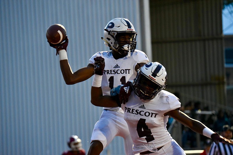 Prescott tight end Jeffery Williams and running back Jaylon Hopson celebrate in the end zone after Williams scored a touchdown against Hope on Friday at Hammons Stadium in Hope, Arkansas. See Page 2C for a regional football roundup.