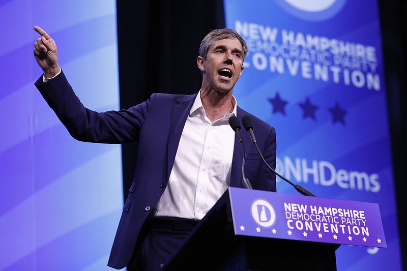 FILE - In this Sept. 7, 2019 file photo, Democratic presidential candidate former U.S. Rep. Beto O'Rourke, D-Texas, speaks during the New Hampshire state Democratic Party convention, in Manchester, NH. O’Rourke’s call to confiscate the millions of AR- and AK-style firearms in the U.S. raised some big questions. How might it be possible to round up all the millions of those rifles in circulation? Could it be done safely? And would it solve the gun violence problem? (AP Photo/Robert F. Bukaty)