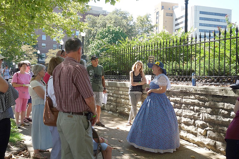 A volunteer dressed in period costume gives a presentation about the Governor's Mansion to visitors who attended the Cole County Historical Society's first Madison Street "Walk Through Time" last fall along Madison and State streets.