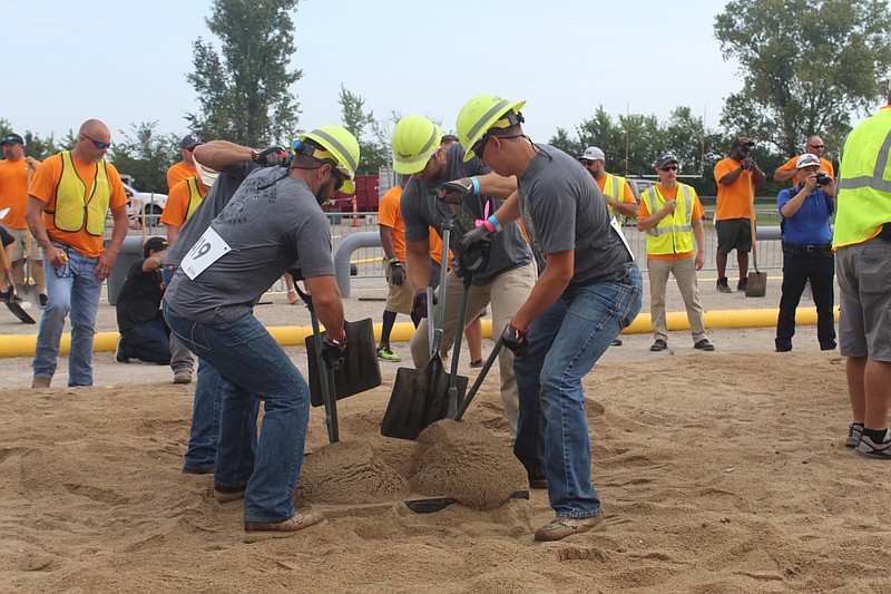 <p>Submitted</p><p>Levi Mealy, center, and his teammates compete in the hand dig contest, one of four qualifying events at the National Gas Rodeo. Out of nearly 60 teams, the Troubadours, from Mid-Missouri, placed 18th.</p>