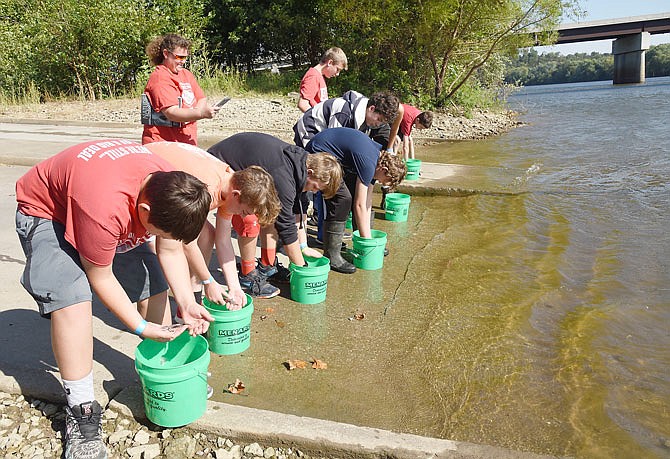 This group of boys prepares to release one lake sturgeon each Friday morning into the Osage River at Missouri Department of Conservation access at Mari-Osa Delta. This was the first time MDC has involved schools in the release of the fish, which is on the state list of endangered species.