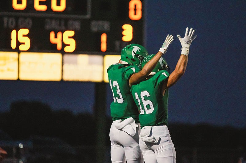 Blair Oaks receivers Carson Prenger and Jake Closser celebrate after Prenger scored in the first quarter of Friday night's game against the Eldon Mustangs at the Falcon Athletic Complex in Wardsville.