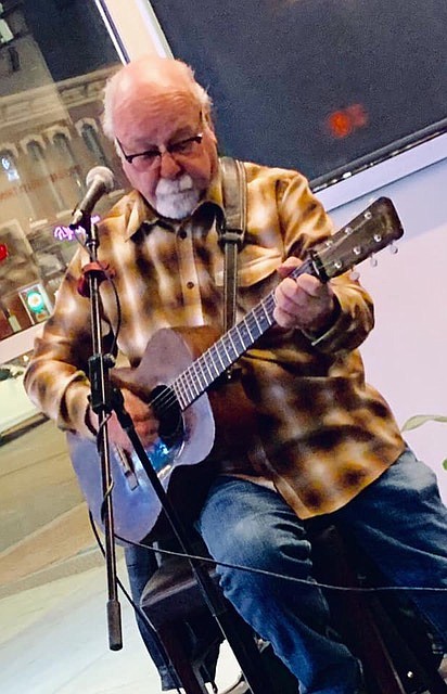 <p>Dennis Schubert performs a solo act with his guitar. Submitted photo</p>