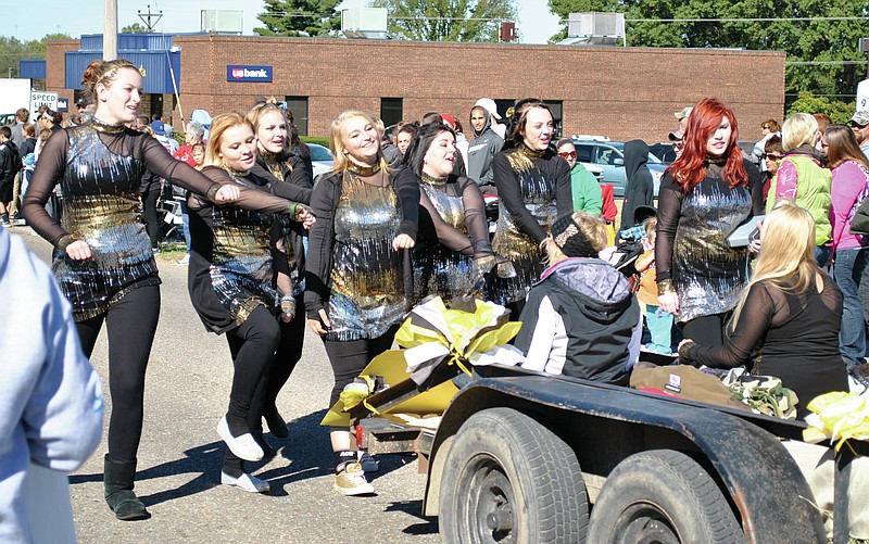 <p>File photo</p><p>The Versailles High School Tigerettes bust some moves as they participate in the 2017 Olde Tyme Apple Festival Parade.</p>