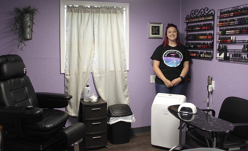 <p>Democrat photo/
Liz Morales</p><p style="text-align:right;">Becca Hamilton, the esthetician for A Good Hair Day in Clarksburg, stands next to her mani/pedicure stations in the newly added spa room.</p>