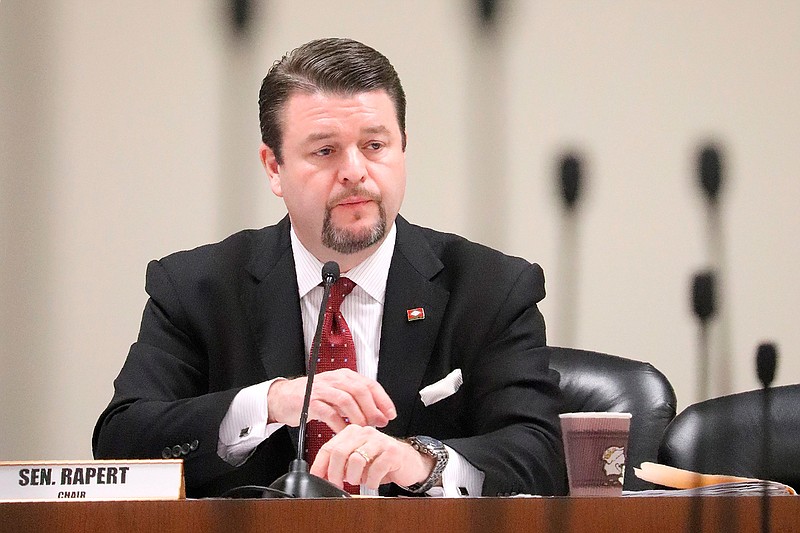  In this March 14, 2018, file photo, state Sen. Jason Rapert, R-Conway, presides over a Senate committee at the state Capitol in Little Rock, Ark. On Monday, Sept. 30, 2019, a federal judge ordered that a lawsuit against Rapert, alleging that he violated the First Amendment rights of an atheist group, can proceed to trial. The national American Atheists group is suing Rapert for allegedly violating some atheists' right to free speech when he blocked their comments from his social media accounts. (AP Photo/Kelly P. Kissel, File)