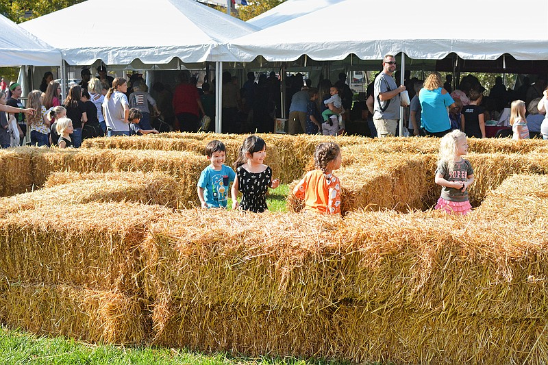 Children play in a hay maze during the 2018 Parson Family Fall Festival outside of the Governor's Mansion. The festival will return Saturday.