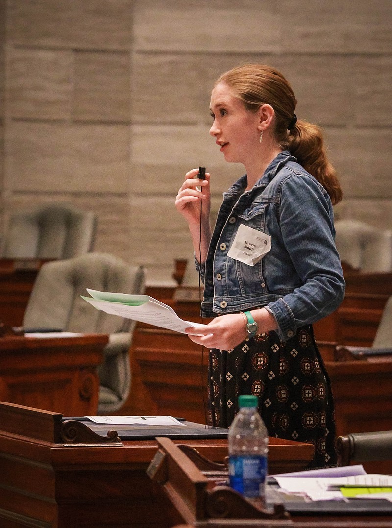 News Tribune/Tara Goins---Gracie Smith from Eldon stands up in support of a bill at the mock legislative session for 6th-8th graders hosted by the Missouri Catholic Conference Saturday afternoon at the State Capitol.