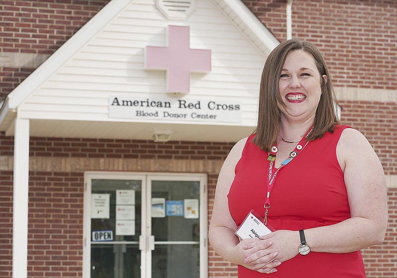 Abigail Anderson poses at the Red Cross of Central land Northeast Missouri office where she serves as executive director. 
