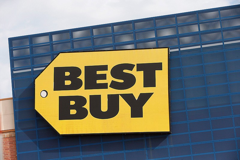 In this Aug. 27, 2019, file photo, the Best Buy logo is shown on a store in Richfield, Minn. Best Buy Co., the nation's largest consumer electronics chain, says it plans to expand its remote monitoring services of seniors to 5 million from 1 million in five years. (AP Photo/Jim Mone, File)