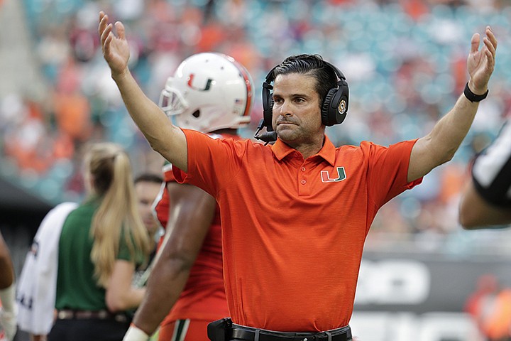 Miami head coach Manny Diaz reacts during the second half of an NCAA college football game against Virginia Tech, Saturday, Oct. 5, 2019, in Miami Gardens, Fla. (AP Photo/Lynne Sladky)