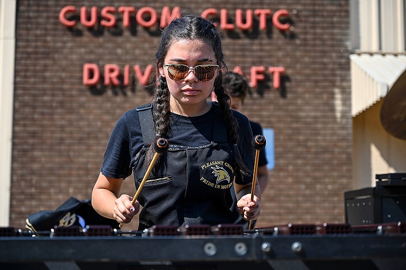  Pleasant Grove High School Band Bionic member Julia Lavay warms up on the marimba Saturday before the annual Four States Invitational Marching Contest at Tiger Stadium at Grim Park in Texarkana, Texas. Twenty-five schools from the Four States Area gathered to demonstrate their musical and marching talents before regional contests. 