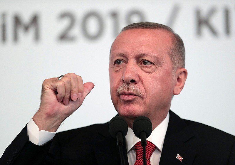 Turkey's President Recep Tayyip Erdogan, talks to to supporters during an event in Ankara, Turkey, Saturday, Oct. 5, 2019. Erdogan threatened Saturday to launch a solo military operation into northeastern Syria, where U.S. troops are deployed and have been trying to defuse tension between its NATO ally and Syrian Kurdish forces.