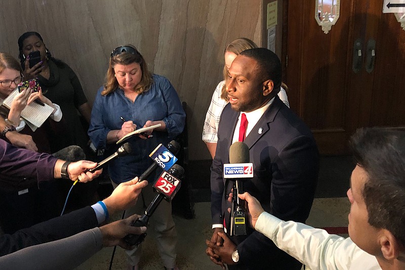 Oklahoma State Rep. Jason Lowe speaks to the media Monday, Oct. 7, 2019 in Oklahoma City after he and other advocates for tighter gun laws filed a lawsuit challenging a new Oklahoma law that will allow people to carry firearms without a background check or training. Lowe filed his lawsuit Monday in Oklahoma county, arguing the law violates a constitutional requirement that bills deal with only one subject matter. (AP Photo/Sean Murphy)