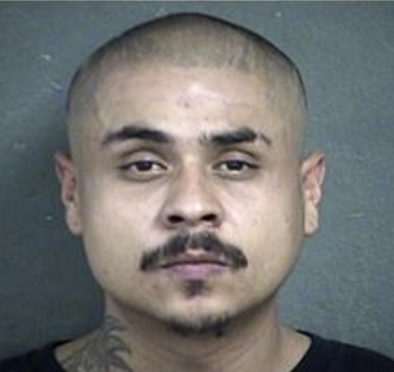 This undated photo provided by the Kansas City Kansas Police Department shows Hugo Villanueva-Morales. Villanueva-Morales, one of the two men accused of opening fire inside a Kansas bar early Sunday, Oct. 6, 2019, remains at large, while the other man Javier Alatorre, was arrested Sunday afternoon, police said. Villanueva-Morales and Alatorre were each charged with four counts of first-degree murder, police in Kansas City, Kansas, said in an early Monday, Oct. 7 release. (Kansas City Kansas Police Department via AP)