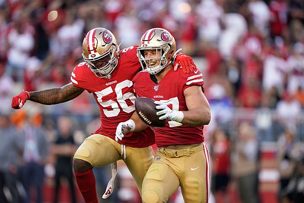 49ers defensive end Nick Bosa celebrates with middle linebacker Kwon Alexander after recovering a fumble by Browns quarterback Baker Mayfield during the first half of Monday night's game in Santa Clara, Calif.