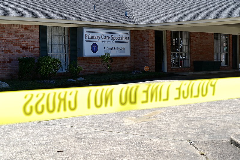 DEA and FBI agents search Primary Care Specialists at the intersection of 24th and County Avenue on Tuesday, October 8, 2019, in  Texarkana, Arkansas. 