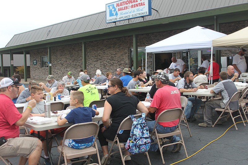 <p>Democrat photo/Liz Morales</p><p>A hearty crowd of hungry Moniteau County residents chow down on an assortment of barbecue options Sept. 28 for the Moniteau County K-9 Fundraiser. Every dollar raised through the barbecue goes to the care of the two K-9 officers, Mizzou and Apollo.</p>