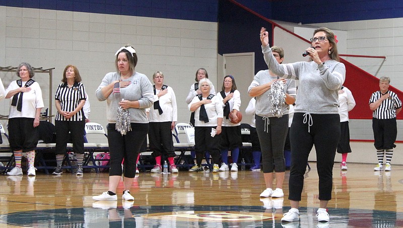 Beth Schoeneberg belts out the last line of "The Star Spangled Banner" Saturday, Oct. 5, 2019, just before the Granny Basketball League took on the Old Gray Mules at the California Middle School gym. Schoeneberg also served as a cheerleader for the mules in addition to Pauline Forck, Dana Wheatley and Judy Scott.