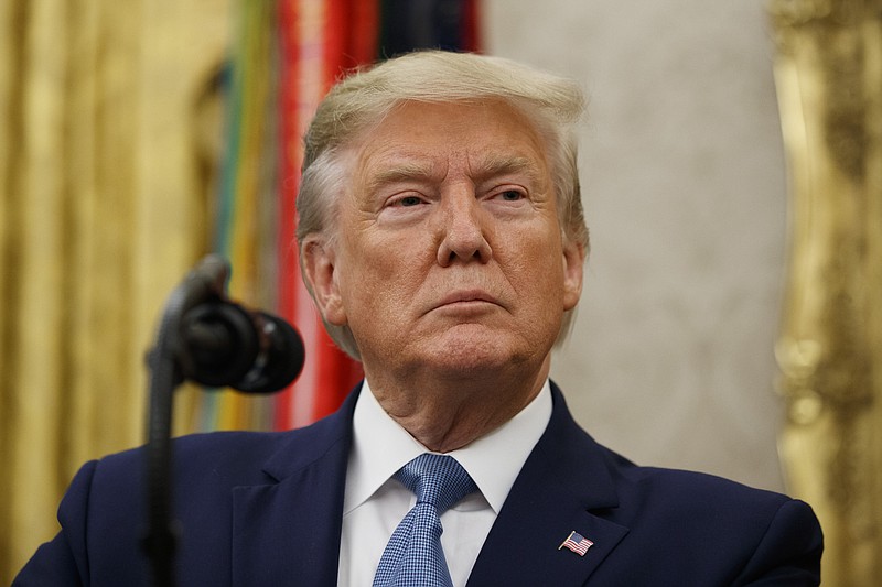 President Donald Trump pauses before speaking during a ceremony to present the Presidential Medal of Freedom to former Attorney General Edwin Meese, in the Oval Office of the White House, Tuesday, Oct. 8, 2019, in Washington. (AP Photo/Alex Brandon)