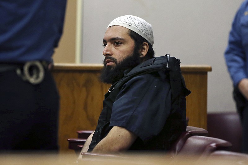FILE - In this Dec. 20, 2016 file photo, Ahmad Khan Rahimi, the man accused of setting off bombs in New Jersey and New York's Chelsea neighborhood, sits in court in Elizabeth, N.J. Rahimi, an Islamic terrorist already serving a life prison term for a bombing in New York City, was convicted Tuesday, Oct. 8, 2019, of multiple counts of attempted murder and assault stemming from a shootout with police three years ago in New Jersey. (AP Photo/Mel Evans, File)