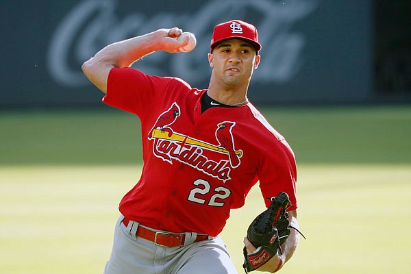 Cardinals pitcher Jack Flaherty throws in the outfield Tuesday during practice in Atlanta. Flaherty is scheduled to start today's Game 5 in the National League Divisional Series against the Braves,