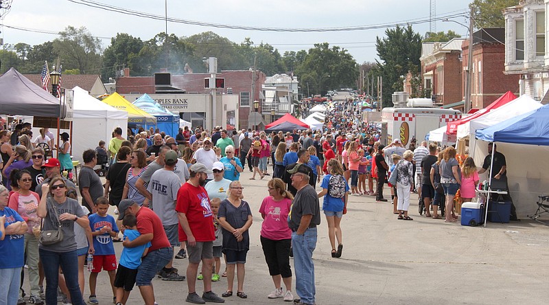 A large crowd lines the street of uptown California, Mo., to enjoy the craft booths and talented musical styles of local musicians Sept. 21, 2019, for the Ozark Ham & Turkey Festival.