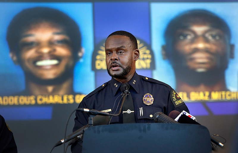 Dallas Assistant Chief of Police Avery Moore addresses the media about a drug deal gone bad resulting in the death of Joshua Brown. The police are still looking for suspects Thaddeous Charles Green and Michael Diaz Mitchell. They already have Mitchell's nephew, Jacquerious Mitchell, in custody. Brown, who was a neighbor of Botham Jean at the South Side Flats, was also a character witness in the Amber Guyger trial. The press conference was held at Dallas Police Headquarters in Dallas, Tuesday, Oct. 8, 2019. (Tom Fox/The Dallas Morning News via AP)