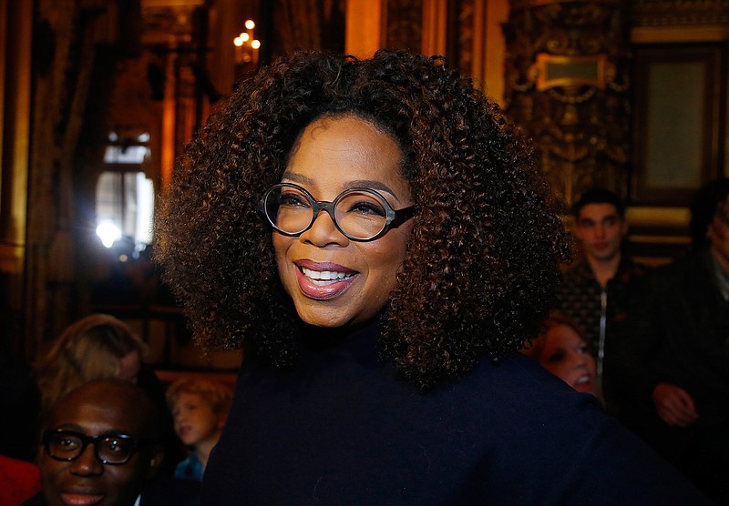 This March 4, 2019 file photo shows Oprah Winfrey at the presentation of Stella McCartney's ready-to-wear Fall-Winter 2019-2020 fashion collection in Paris. Winfrey says she's giving $13 million to increase a scholarship endowment at Morehouse College in Atlanta, a historically black college. (AP Photo/Michel Euler, File)