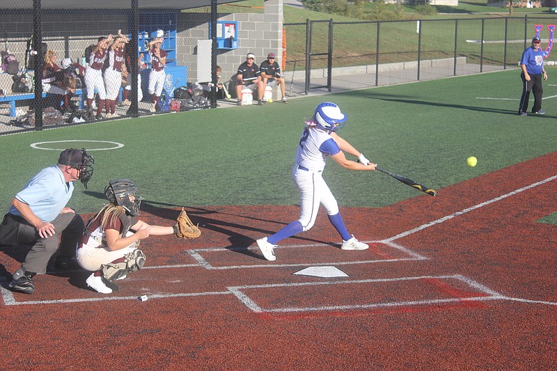 <p>Democrat photo/ Kevin Labotka</p><p>Camryn Schlup scores two runs on a base hit in the Pintos’ 8-1 win over Osage.</p>