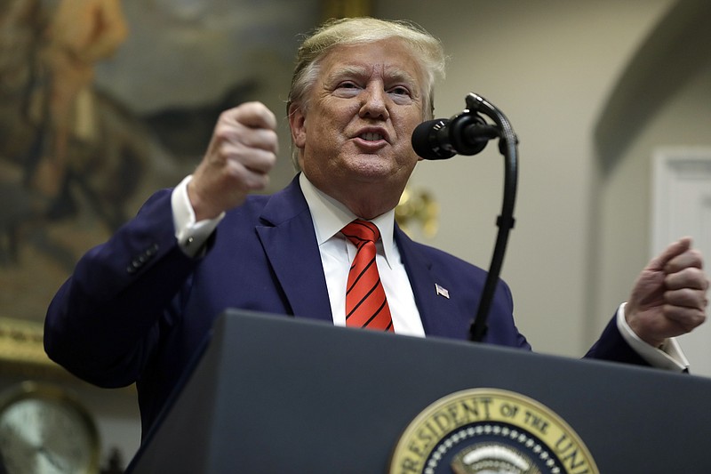 President Donald Trump answers questions from reporters during an event on "transparency in Federal guidance and enforcement" in the Roosevelt Room of the White House, Wednesday, Oct. 9, 2019, in Washington. (AP Photo/Evan Vucci)