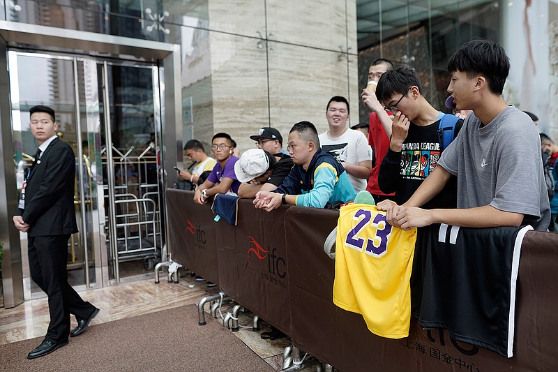 Chinese basketball fans gather outside of a hotel for a press conference that was later postponed ahead of an NBA preseason basketball game on Thursday between the Los Angeles Lakers and Brooklyn Nets in Shanghai, China, Wednesday, Oct. 9, 2019. The NBA has postponed Wednesday's scheduled media sessions in Shanghai for the Brooklyn Nets and Los Angeles Lakers, and it remains unclear if the teams will play in China this week as scheduled. (AP Photo)