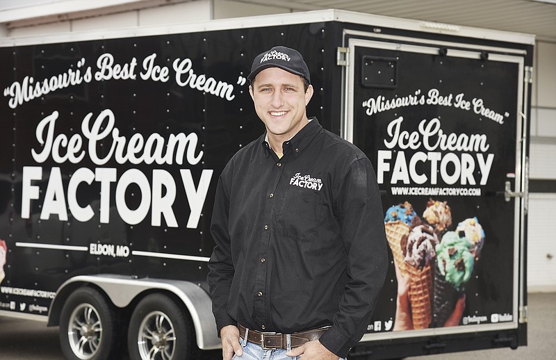 Julie Smith/News Tribune
Shannon Imler poses in front of his delivery trailer Friday morning during a stop in Jefferson City. Imler was on his way to make several stops to shops who feature his company's ice cream made in Eldon. Renovation is under way at the building at 701 Madison St. that will serve as a Jefferson City location for the product. 