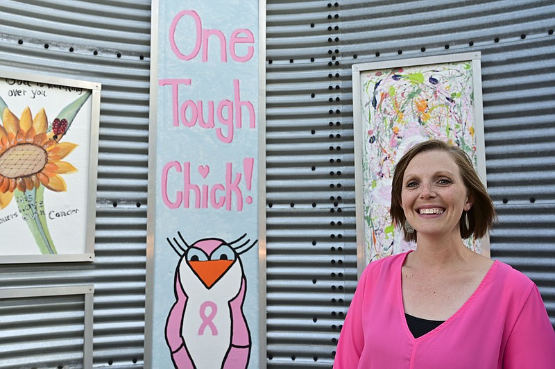 Sarah Newman poses for a portrait after the unveiling of Breast Cancer Awareness art hanging at the Texarkana Regional Arts And Humanities Council's ArtSpark Art Wall on Monday in Texarkana, Texas. Newman was named the Susan G. Komen Race for the Cure Texarkana Honorary Survivor for 2019. 