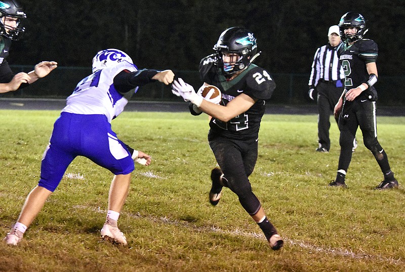 North Callaway junior running back Cody Cash tries to break past a Montgomery County defender during the Thunderbirds' 28-22 EMO victory over the Wildcats on Friday night in Kingdom City.